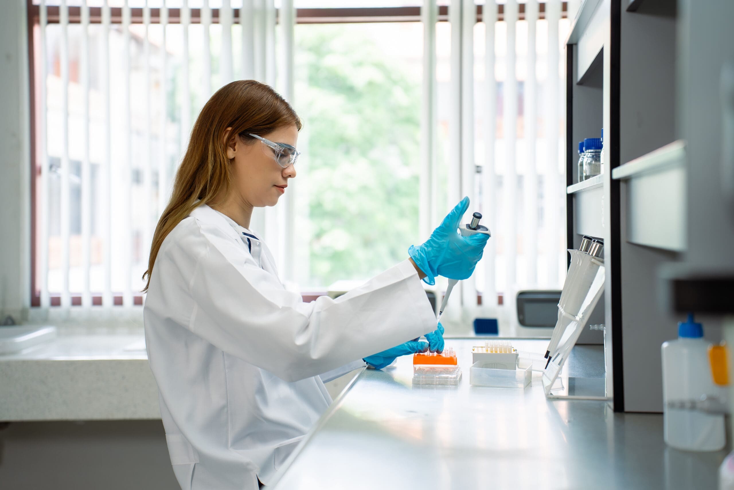 Researcher using equipment in lab setting