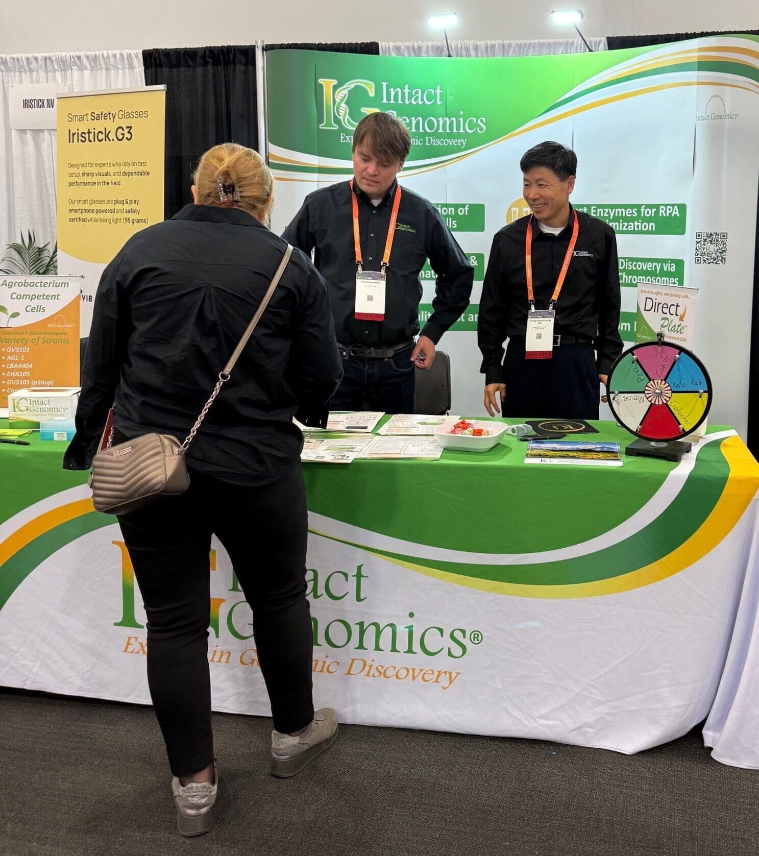 Intact Genomics representatives at exhibit table